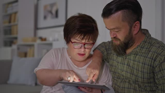 Husband and wife using tablet