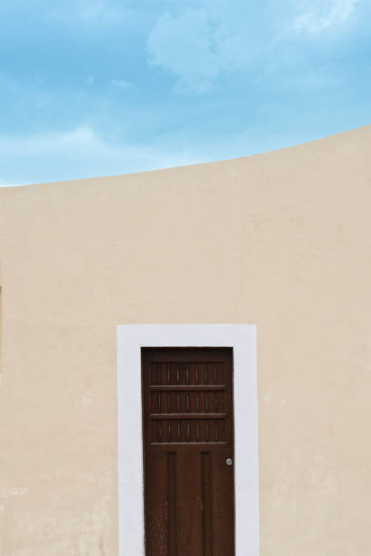 istock wood vintage door with yellow facade 1963894163