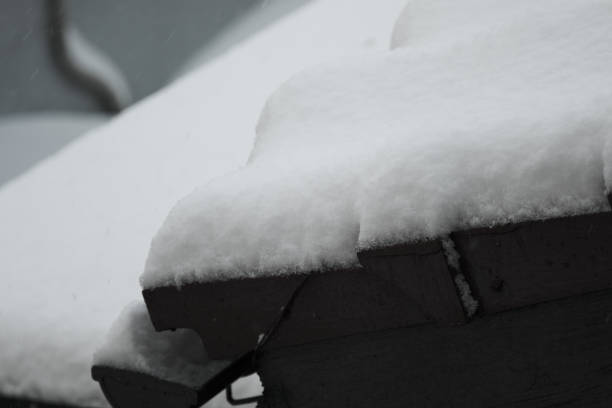Scenery of snow accumulating on tiles