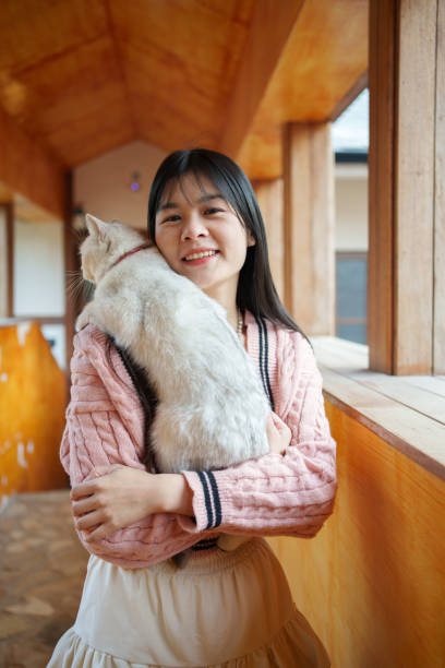 istock Asian woman holding cat 1964101039