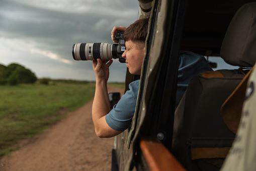 Professional photographer taking photos at Safari trip
