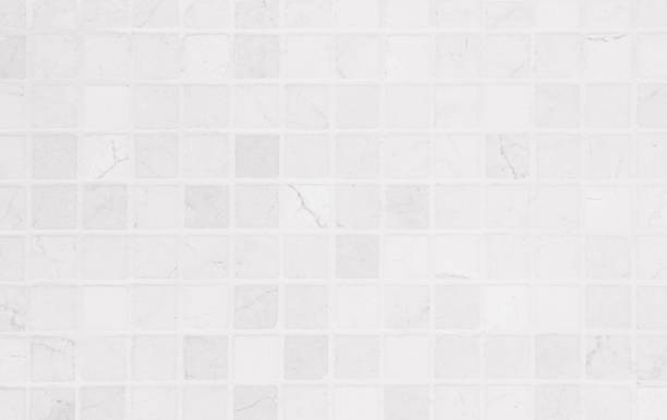 istock White tile wall chequered background bathroom texture. Ceramic brick wall and floor tiles mosaic background in bathroom and kitchen clean. Design pattern geometric with grid wallpaper floor elements. 1964192891