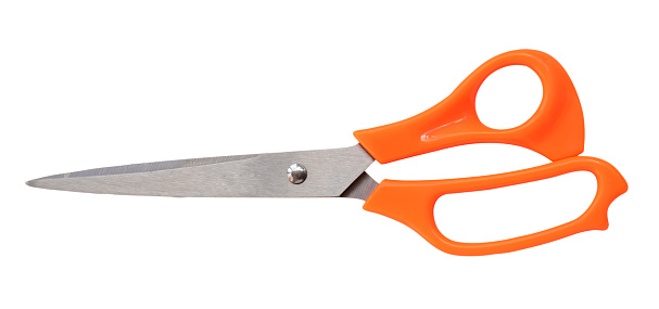 Top view of multipurpose scissors with orange handle is isolated on white background with clipping path.