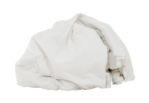 White crumpled blanket or bedclothes in hotel room leaved untidy and dirty after guest's use over night is isolated on white background with clipping path