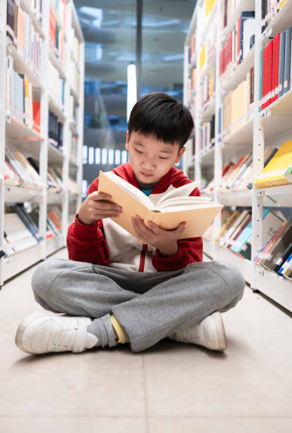 istock Boys to read books in the library 1964233644