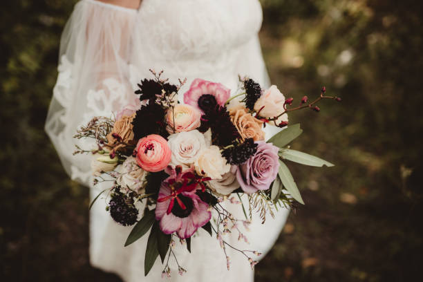 istock Boho wedding dress with bride and bouquet 1964260887