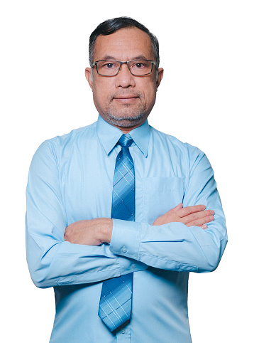 Portrait one man. A professional businessman stands confidently, a lone figure in focus, looking directly at the camera against a clean white background, a singular representation of business prowess