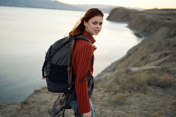 istock hiker in mountains with backpack on shoulders nature lifestyle cropped view 1964286408