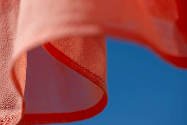 Silk FAbric against a blue sky  moving in the wind,  Washing day