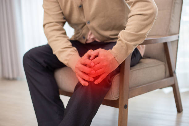 istock Close up hand man touching painful knee. Older having osteoarthritis. Accident falling down kneel ache. health and people concept. 1964318793