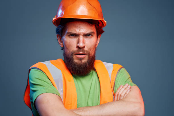 istock Cropped view of bearded man in working uniform construction engineer 1964322945