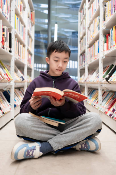 istock Boys to read books in the library 1964322949