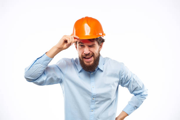 istock man in work uniform orange helmet professional safety industry construction 1964332361