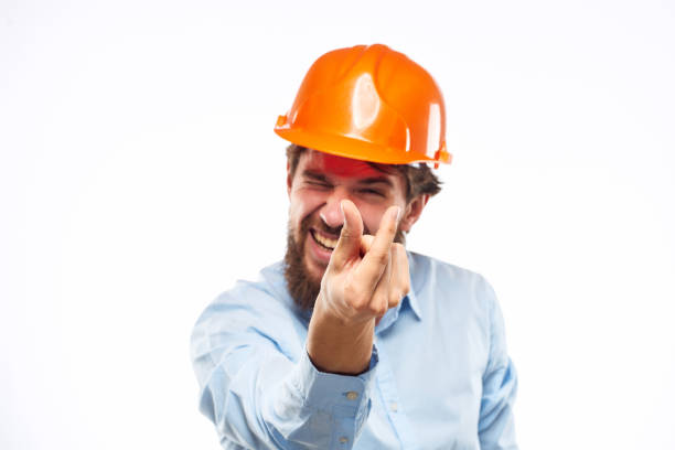 istock Emotional man in orange paint construction industry work lifestyle 1964335018