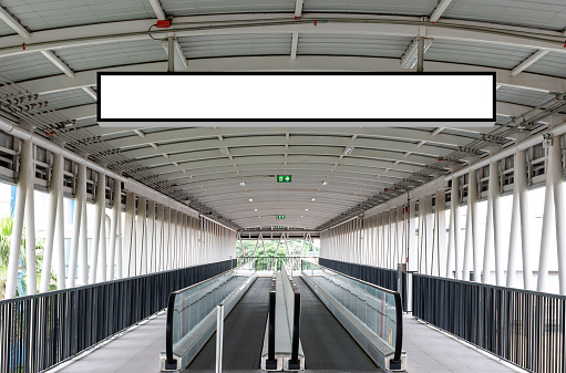 Mock up hanging white rectangle billboard at footbridge with clipping path for mock up
