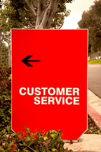 A red rectangular Customer Service Sign