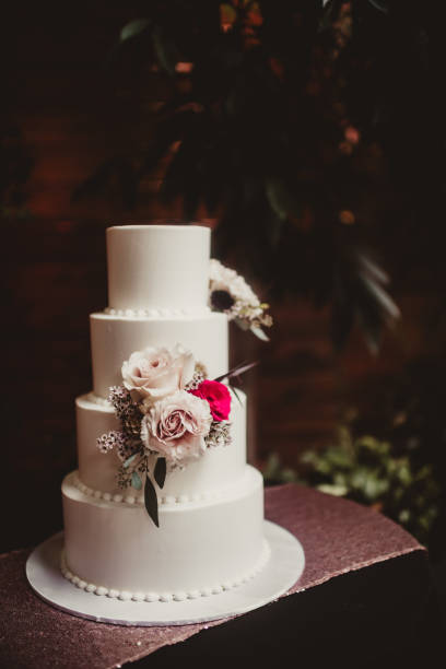 istock Layered vanilla wedding cake with flowers 1964402699