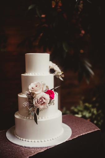 Elegant wedding cake with layers and flowers
