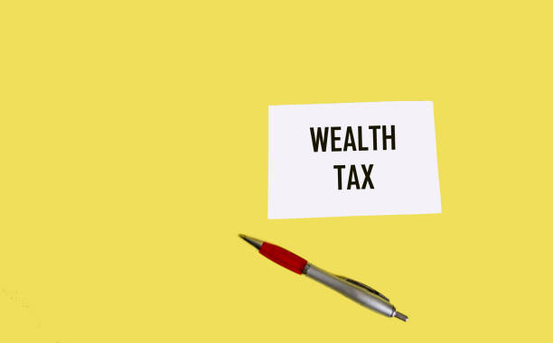 istock Text BIG TAX on a notepad and yellow background. Business concept 1964437903