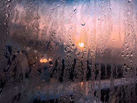 Dew or water particles on glass windows in the morning in cold weather