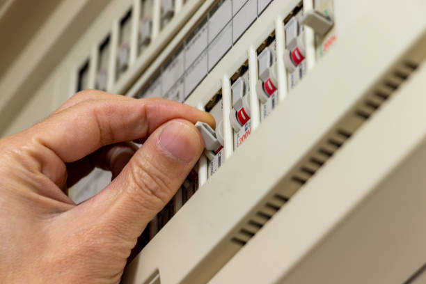 istock Operate the breaker switch on the distribution board with fingers 1964465107