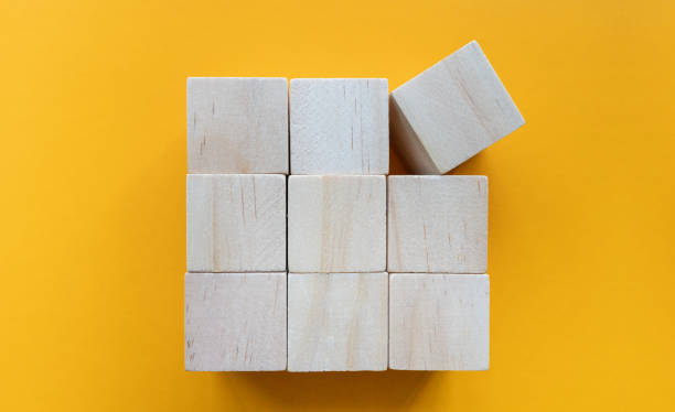 istock Toy block on yellow paper 1964469148
