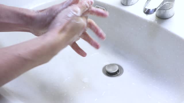 wash both hands thoroughly with soap