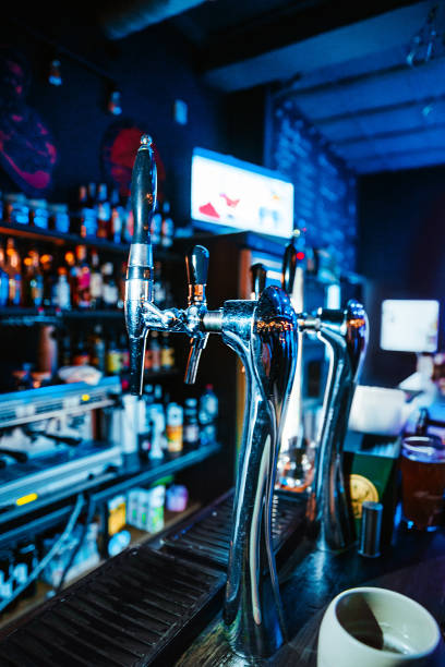 istock Many beer taps in night bar or pub 1964564227
