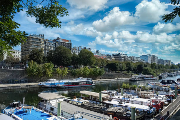 Paris, Bastille, the harbor with houseboats, and typical facade in background