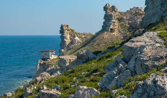 View of the steep banks and rocks in the water in the Dzhangul tract, western Crimea