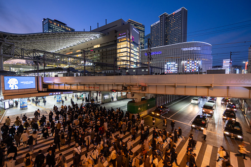 Osaka, Japan - January 19, 2024 : Pedestrians walk past the JR Osaka Station in Osaka, Japan. It is a major railway station in the Umeda of Kita-ku, Osaka, Japan.