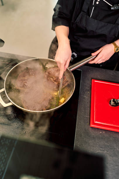 steak is cooking on the stove