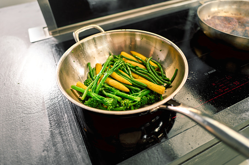 Vegetables are cooking on the stove