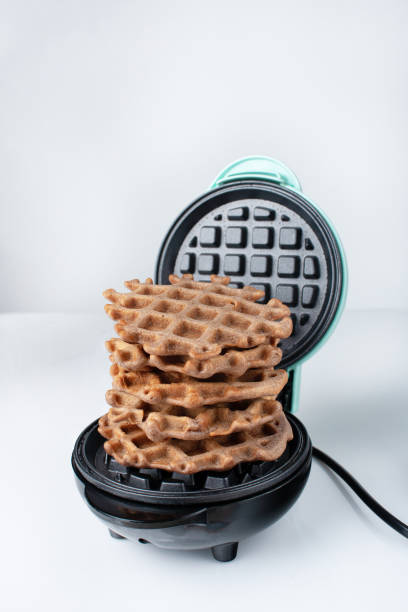 istock a stack of waffles lies in an electric waffle iron 1964710155