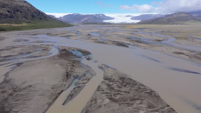 Aerial view of glacier river streams from above, Fallsjokul glacier, Iceland. Icelandic glacial river bed and moraine