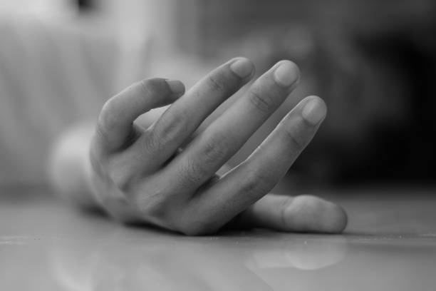 istock a man collapsed on the floor,focus on Hands, tired or sick concept. 1964751214