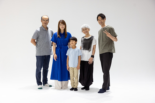 Family portrait in photo studio - five people