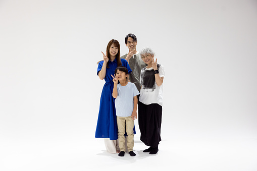 Family portrait in photo studio - peace sign