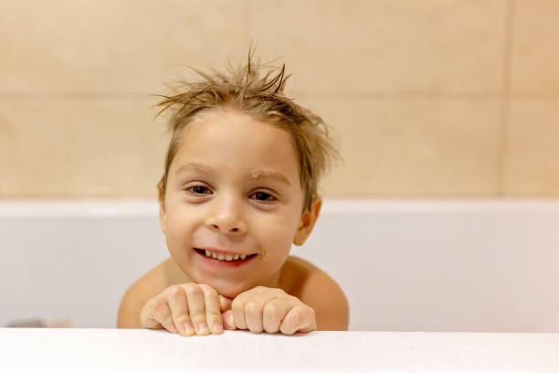 Cute baby boy, child, in bath, smiling