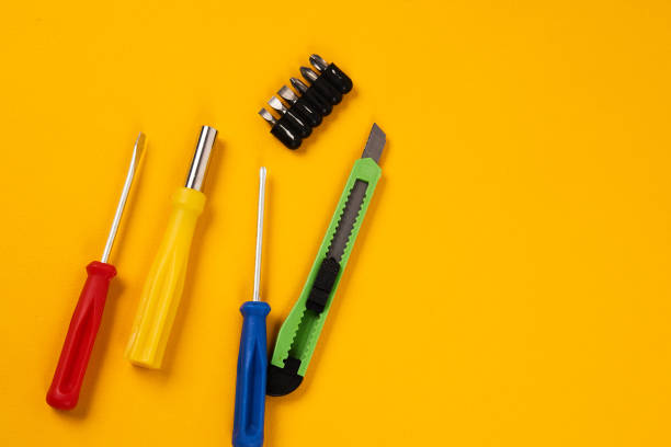 istock screwdrivers and construction tools on yellow background equipment for repair industry 1964801127