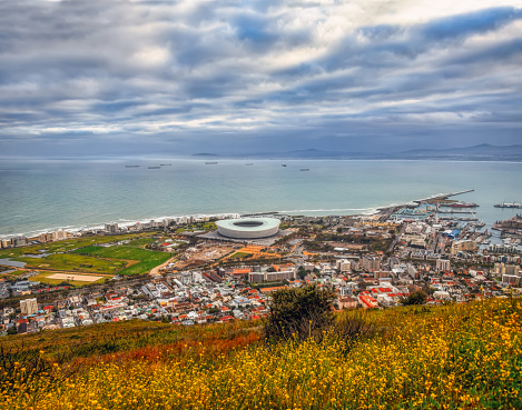 Cape Town in South Africa aerial overview of the town with the harbor side and the transport ships on the ocean