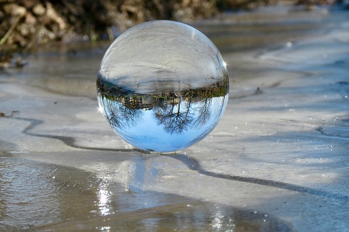 Close up of crystal ball on frozen field
