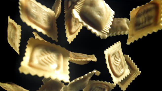 Ravioli fly up and fall down. Filmed on a high-speed camera at 1000 fps.