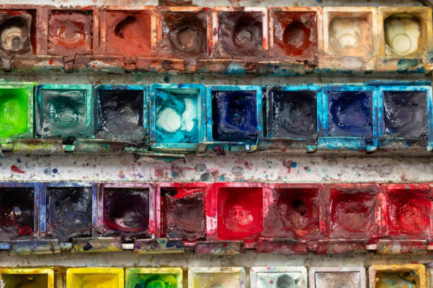 istock Palette with colorful artist paints 1964861159