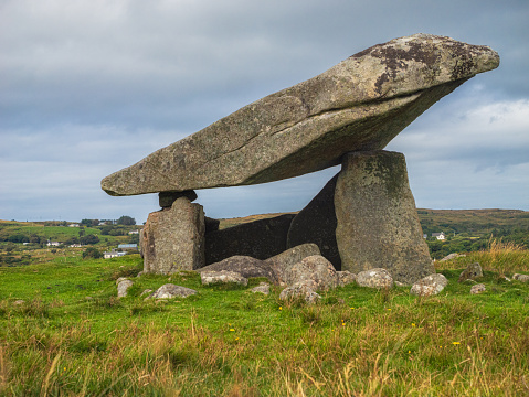 Kilclooney Dolmen is a Neolithic portal tomb located in County Donegal, Ireland. It is one of the finest examples of a portal tomb in Ireland and is estimated to be around 4000 to 4500 years old. The dolmen consists of a large capstone supported by three upright stones, creating a chamber that would have been used for burial purposes.