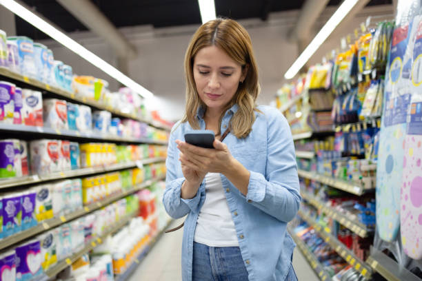 istock Woman with checklist on cell phone 1964880221