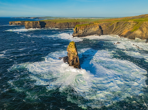Kilkee Cliffs are located in County Clare, Ireland. They are a popular natural attraction, offering stunning views of the rugged coastline and the Atlantic Ocean. Kilkee is known for its scenic beauty, and the cliffs are a notable highlight.