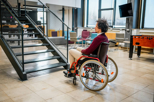 istock A disabled man in a wheelchair at the workplace 1964883942