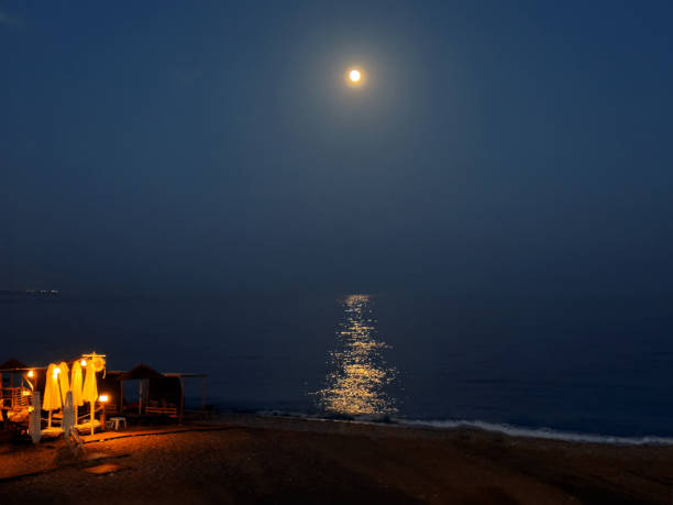 Moon light on sea surface, blue water at night