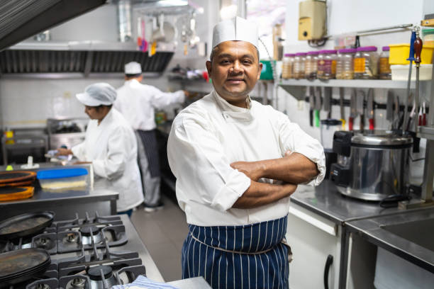 istock Chef, standing in an Indian restaurant kitchen 1964912180